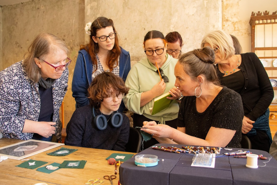 Fiona Harrington demonstrates lace making to Culture Club members