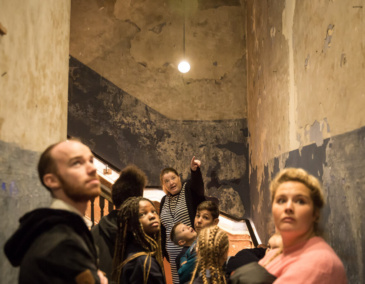 Tour Guide points at architectural feature in 14 Henrietta Street