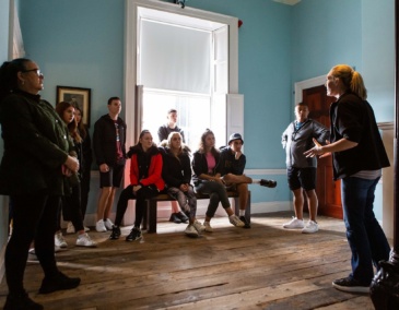 A tour guide tells visitors about the history of 14 Henrietta Street and the people who called the building home