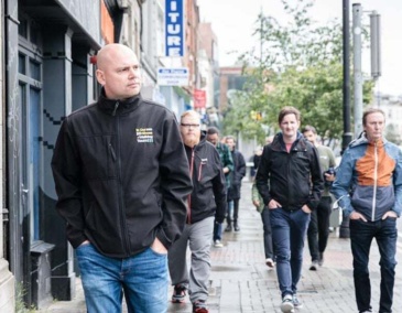 Anthony with tour group behind him