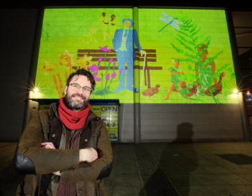 Ben Readman with the finished artwork on the Mater. Photo: Mark Stedman