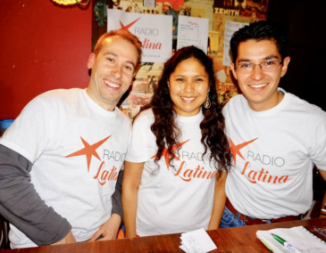Silvia and two of her colleagues wearing Radio Latina T Shirts and smiling