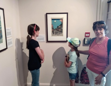 Trish and her granddaughters at a gallery