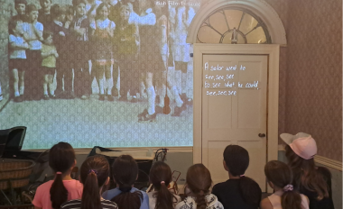14 Henrietta Street schoolchildren in the playroom of 14 Henrietta Street watching a projection on a wall 800 x 540
