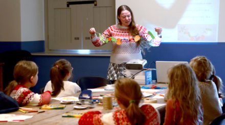 Education children participating in a creative workshop in 14 Henrietta Street watch and listen to Dervilia Historian in Residence for Children 800 x 540