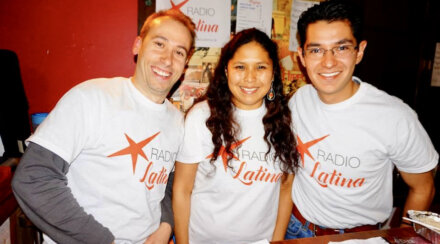 Silvia and two of her colleagues wearing Radio Latina T Shirts and smiling