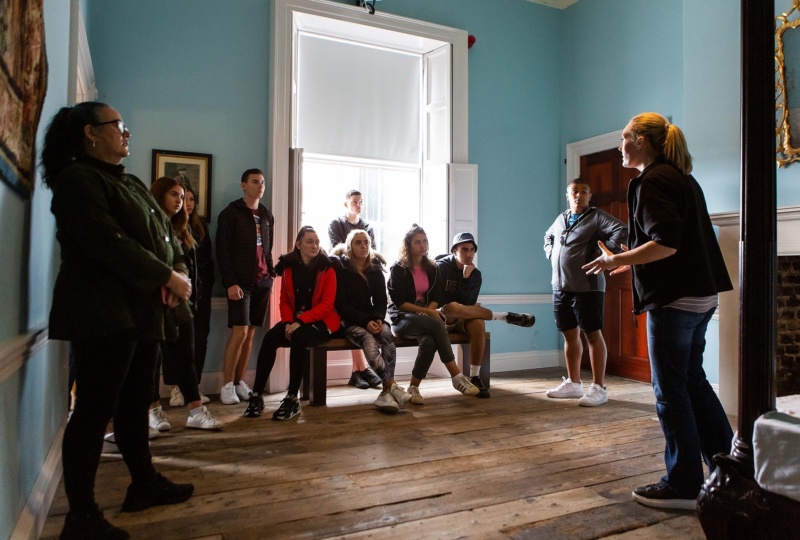 A tour guide tells visitors about the history of 14 Henrietta Street and the people who called the building home