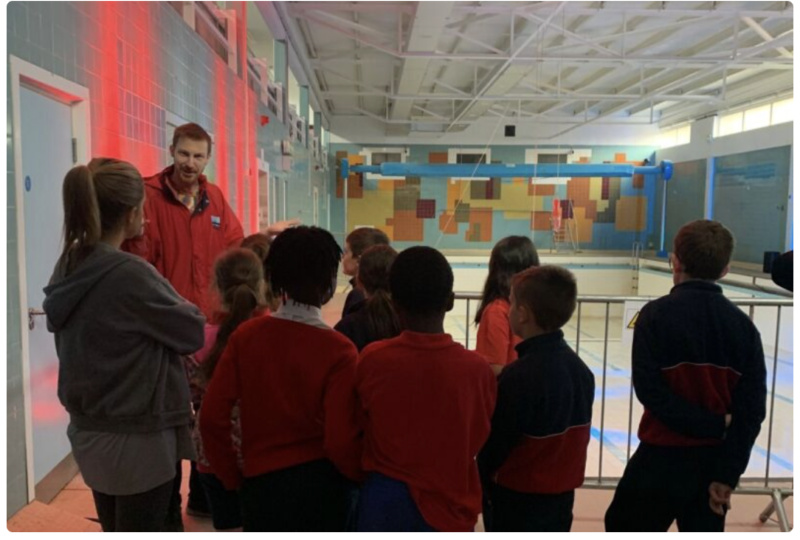 A Visitor Experience Assisitant at Dublin City Council Culture Company welcomes people to an exhibition