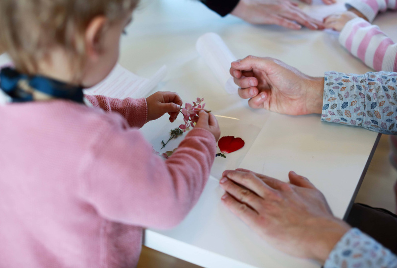 A child holds a flower during a creative workshop at Richmond Barracks Inchicore Dublin 8