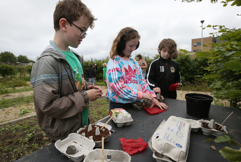 Three children participate in a gardening workshop at Richmond Barracks Inchicore Dublin 8
