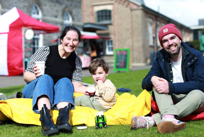 A family in the Richmond Barracks garden during a Fair. Photo: Senija Topcic