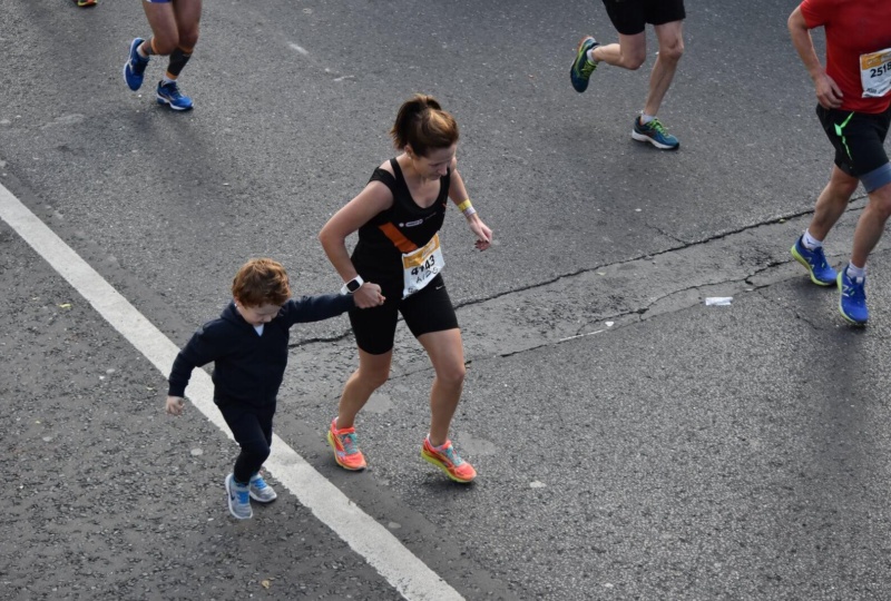 Aideen running the 2016 Dublin marathon, with support from Rian