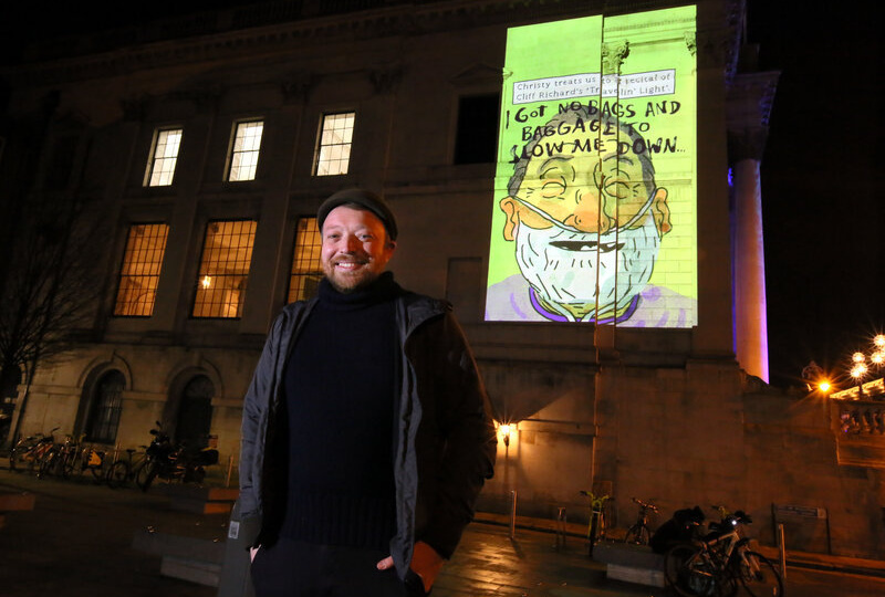 Artist Alan Dunne with his illustrations on City Hall. Credit: Mark Stedman.