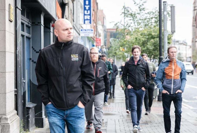 Anthony with tour group behind him