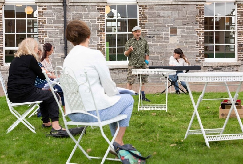 Artist Brian Fleming in Richmond Barracks with participants taking part in The National Neighbourhood made by Dublin City Council Culture Company in partnership with insert name of organisation here Image court