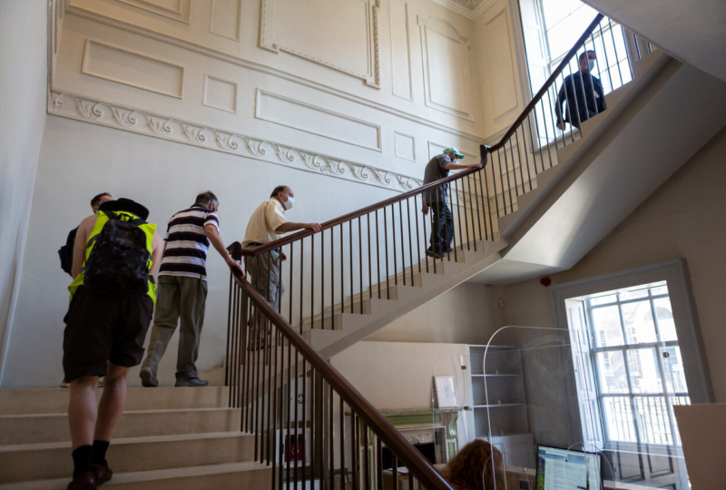 Walking up the main staircase in 14 Henrietta Street. Photographer: Dan Butler.