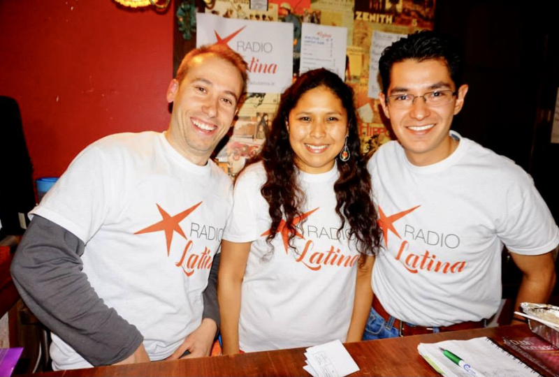 Silvia and two of her colleagues wearing Radio Latina T Shirts and smiling