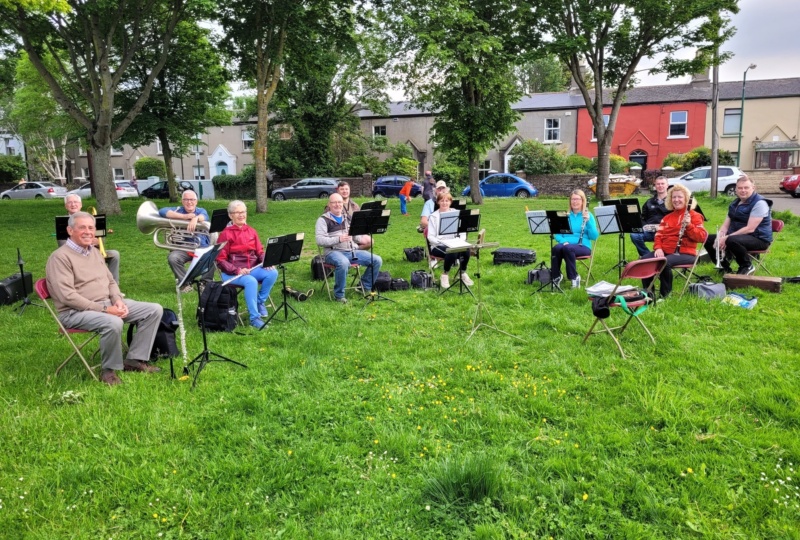 John (third from the left, with tuba) at band rehearsal in the park