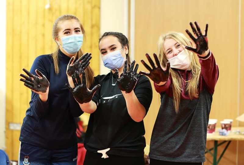 Three young artists taking part in the Good Counsel GAA mural project. Photographer: Senija Topcic