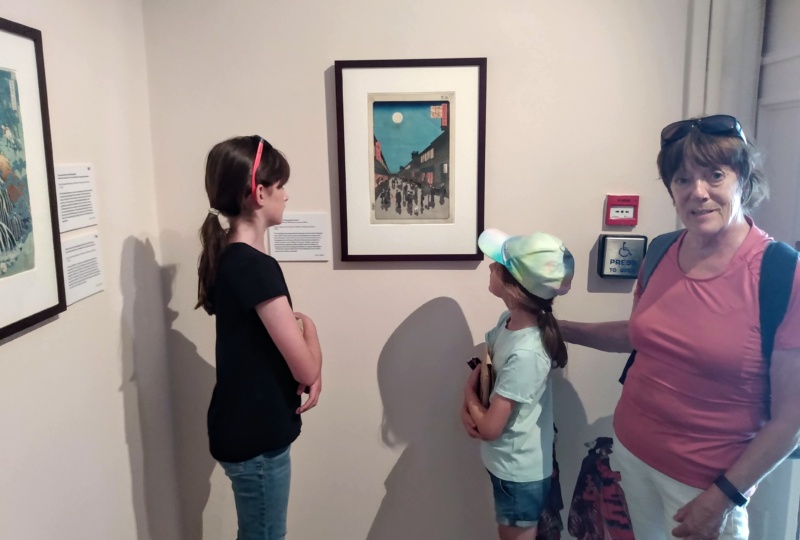 Trish and her granddaughters at a gallery